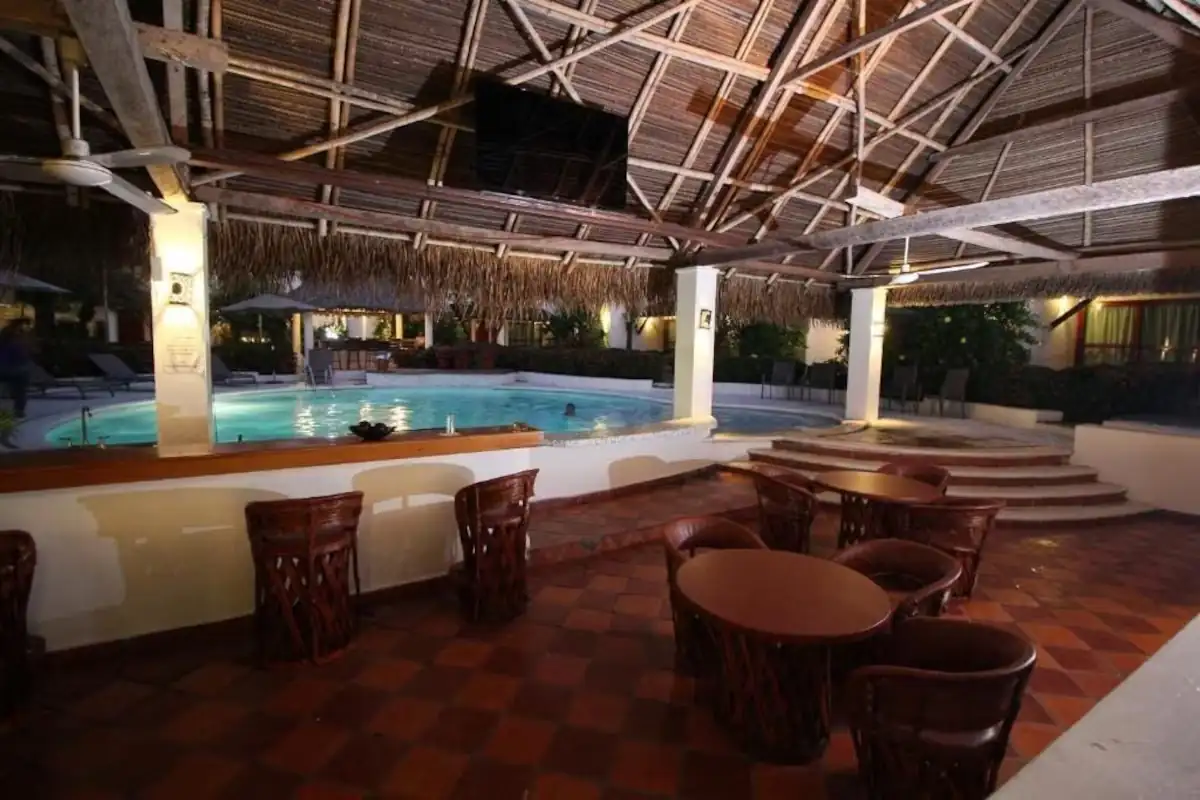 Pool and open-air lounge at Hotel Villa Blanca Suites